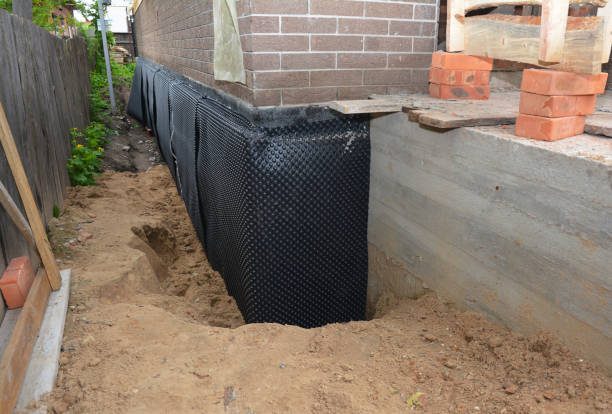 Happy homeowners after waterproofing job in Westport